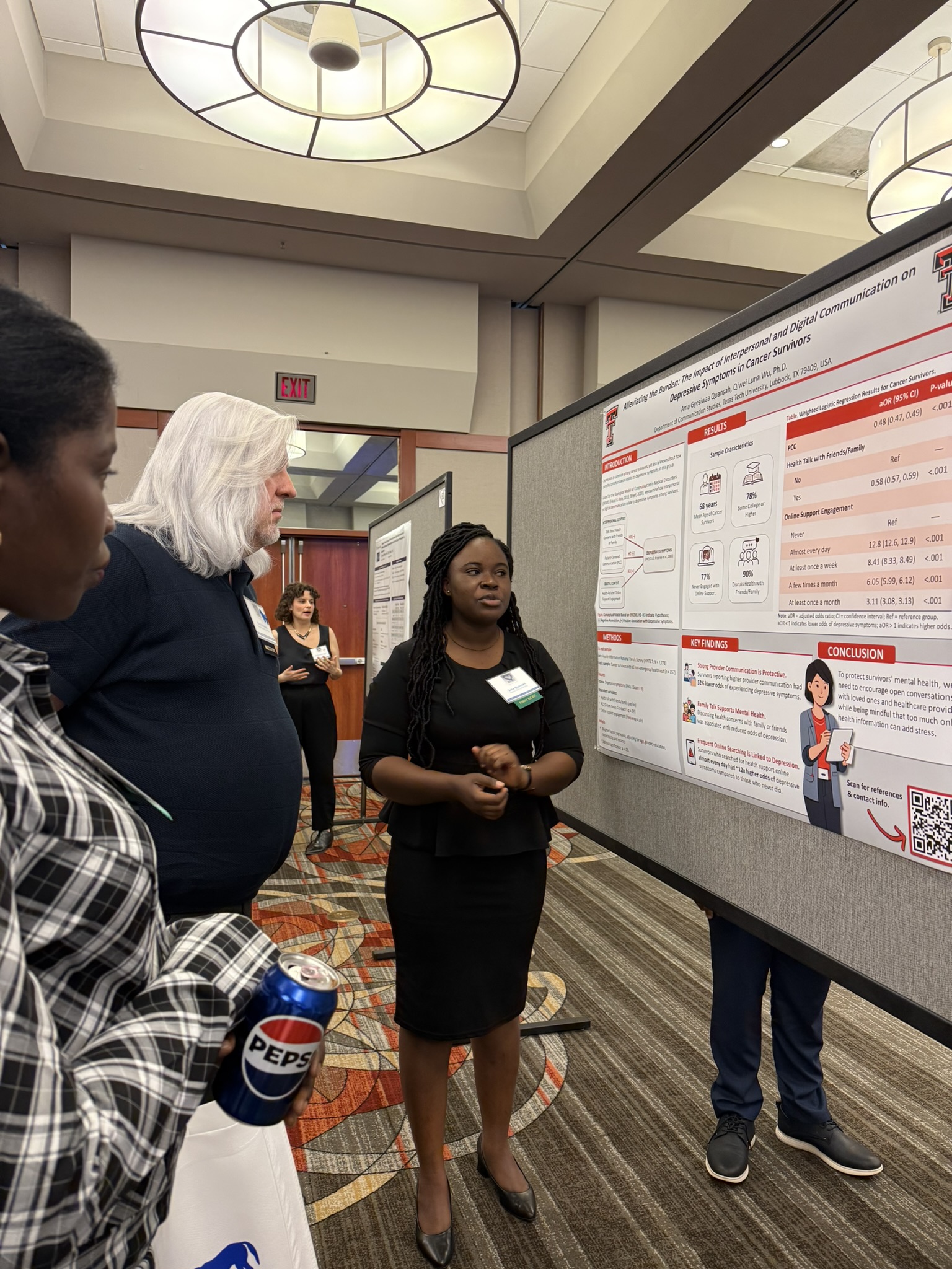 Presenting my research poster to guests at KCHC 2026